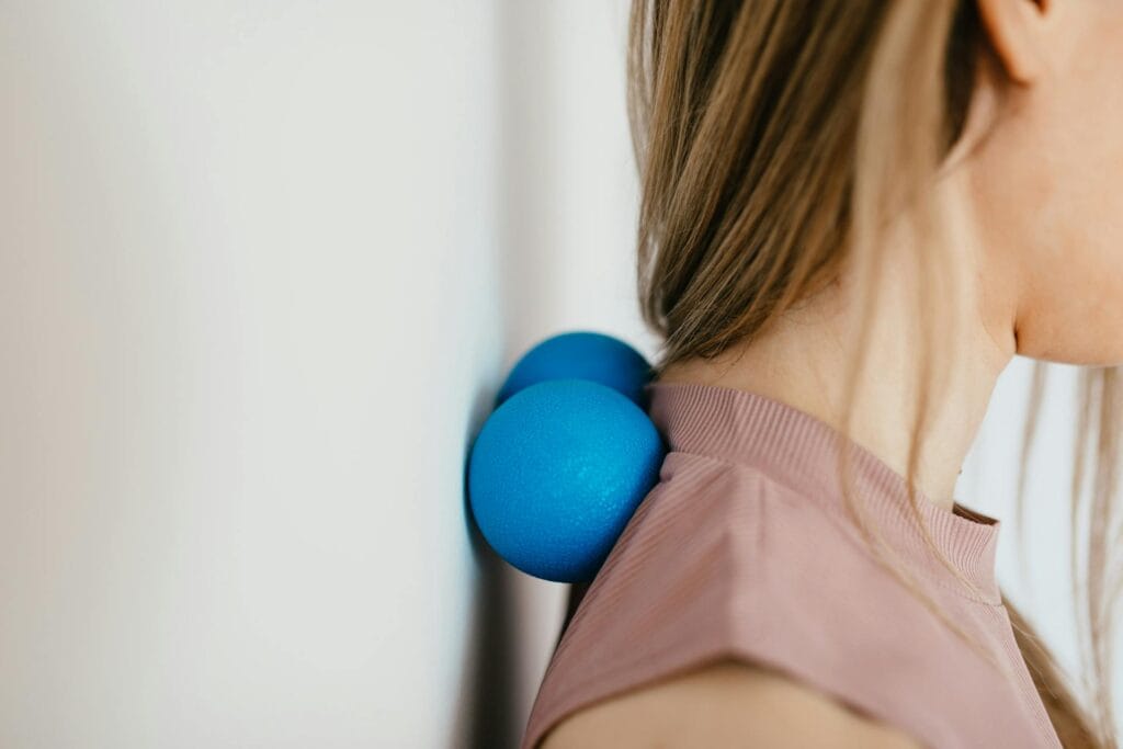 Close-Up Photo of a Woman Pressing Her Neck on a Stress Ball as part of a Medisense Therapy at home in Australia