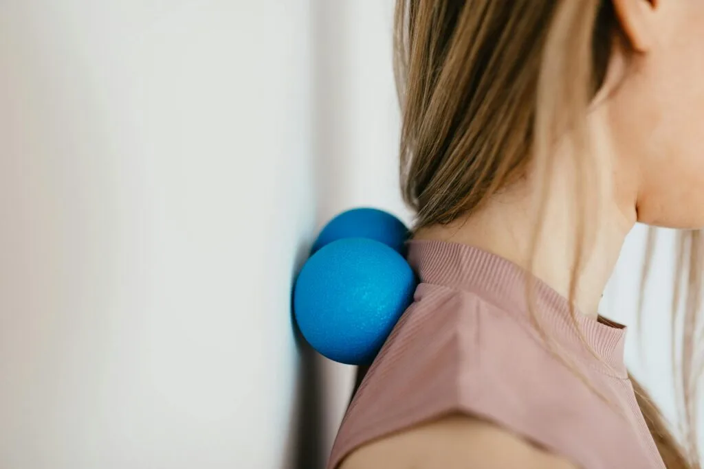 Close-Up Photo of a Woman Pressing Her Neck on a Stress Ball as part of a Medisense Therapy at home in Australia