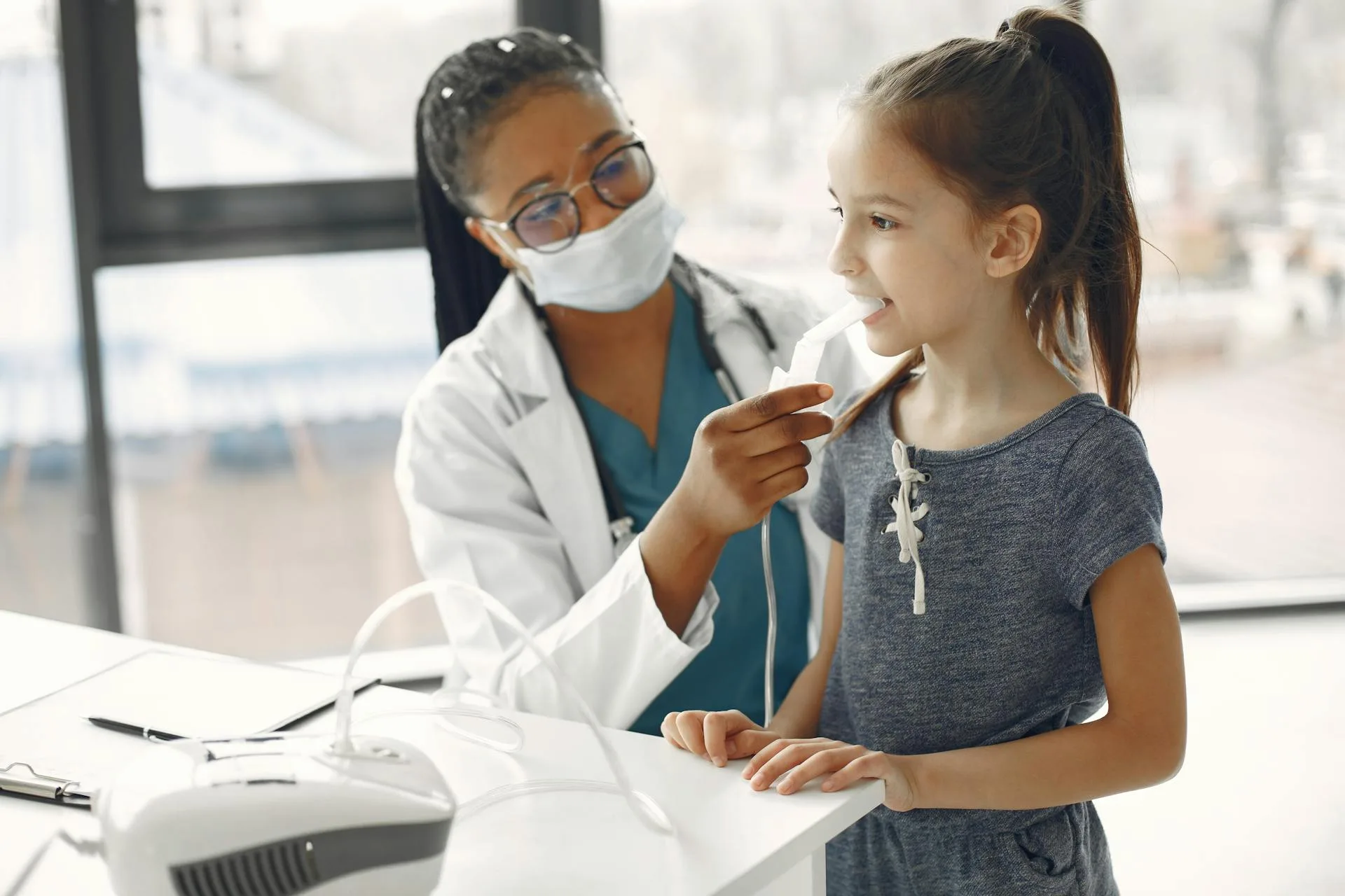 Little Girl at a Medical Checkup with her Medisense paediatrician at home, in Australia