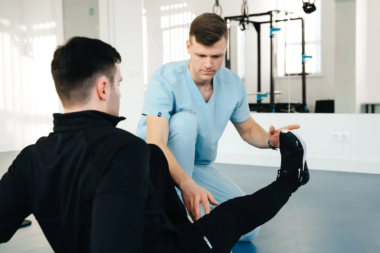 Medisense Physiotherapist Examining the Patients Leg in Australia, as part of the Allied health services