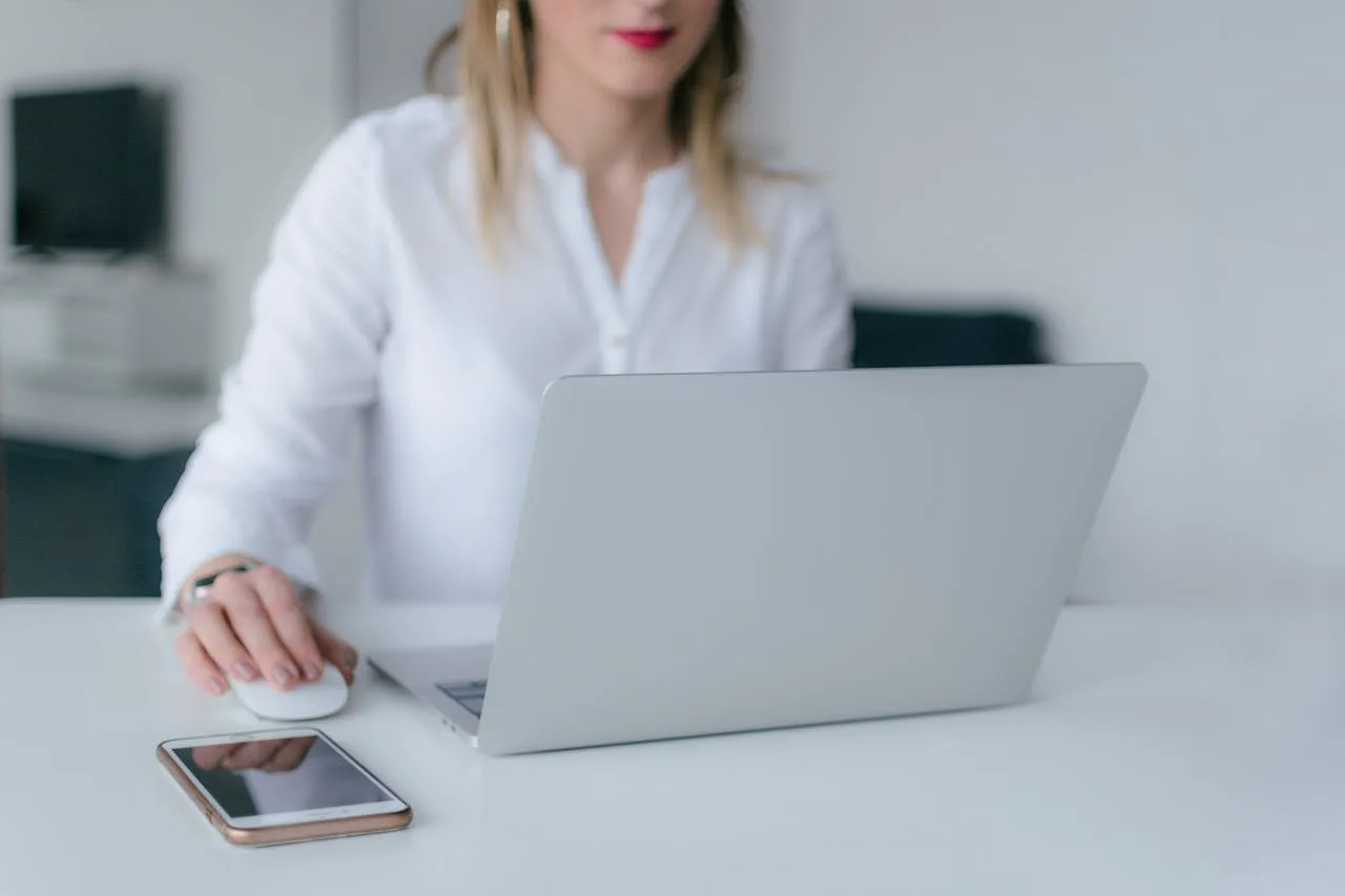 Woman uses her laptop to contact Medisense and get more info about Allied health services Australia