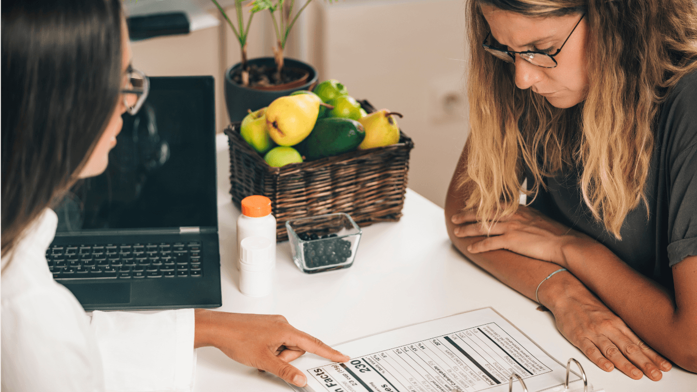 Dietician Explaining Nutritional Facts Label To a patient
