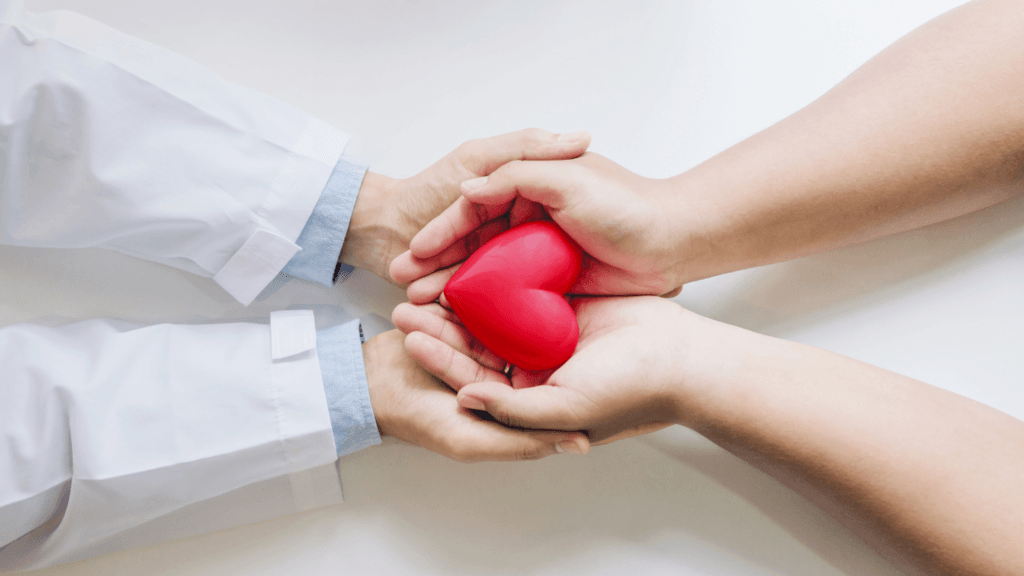 Doctor and Patient Holding a Heart Up Close, to give and receive Allied health services in Australia