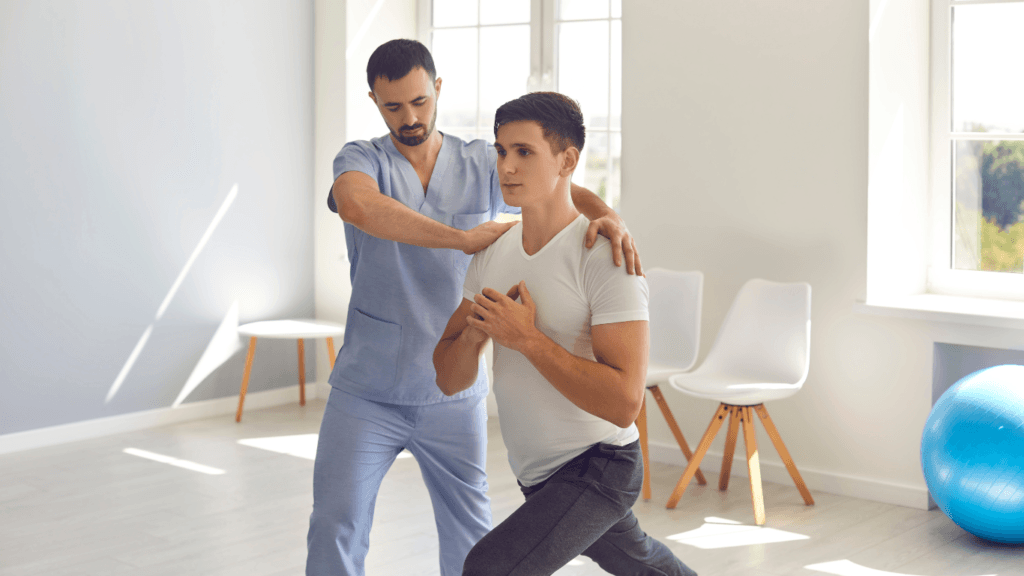 Exercise physiologist Helping Young Male Athlete Recover after Sports Injury