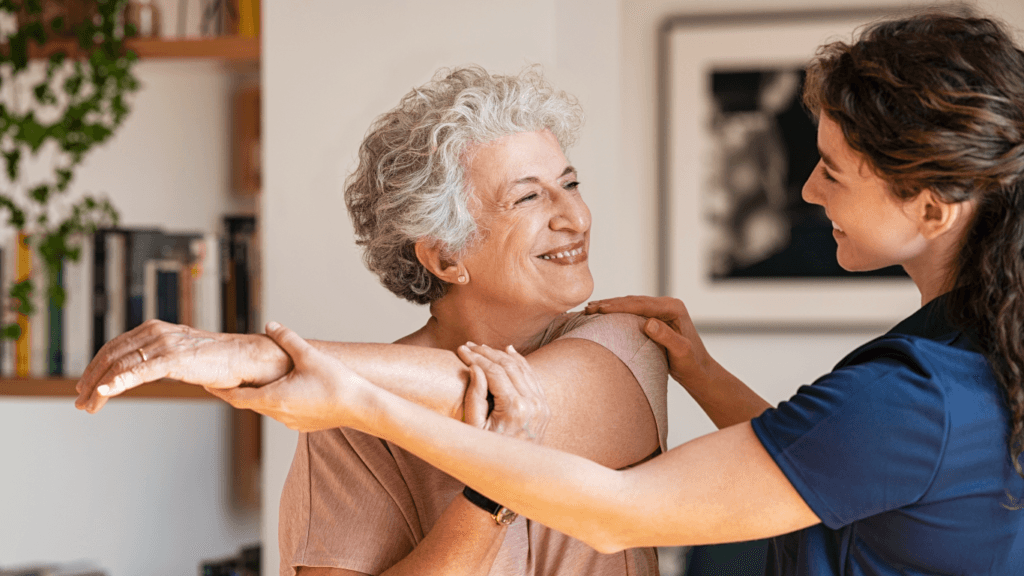Senior Woman with Exercise Physiologist Exercising at Home
